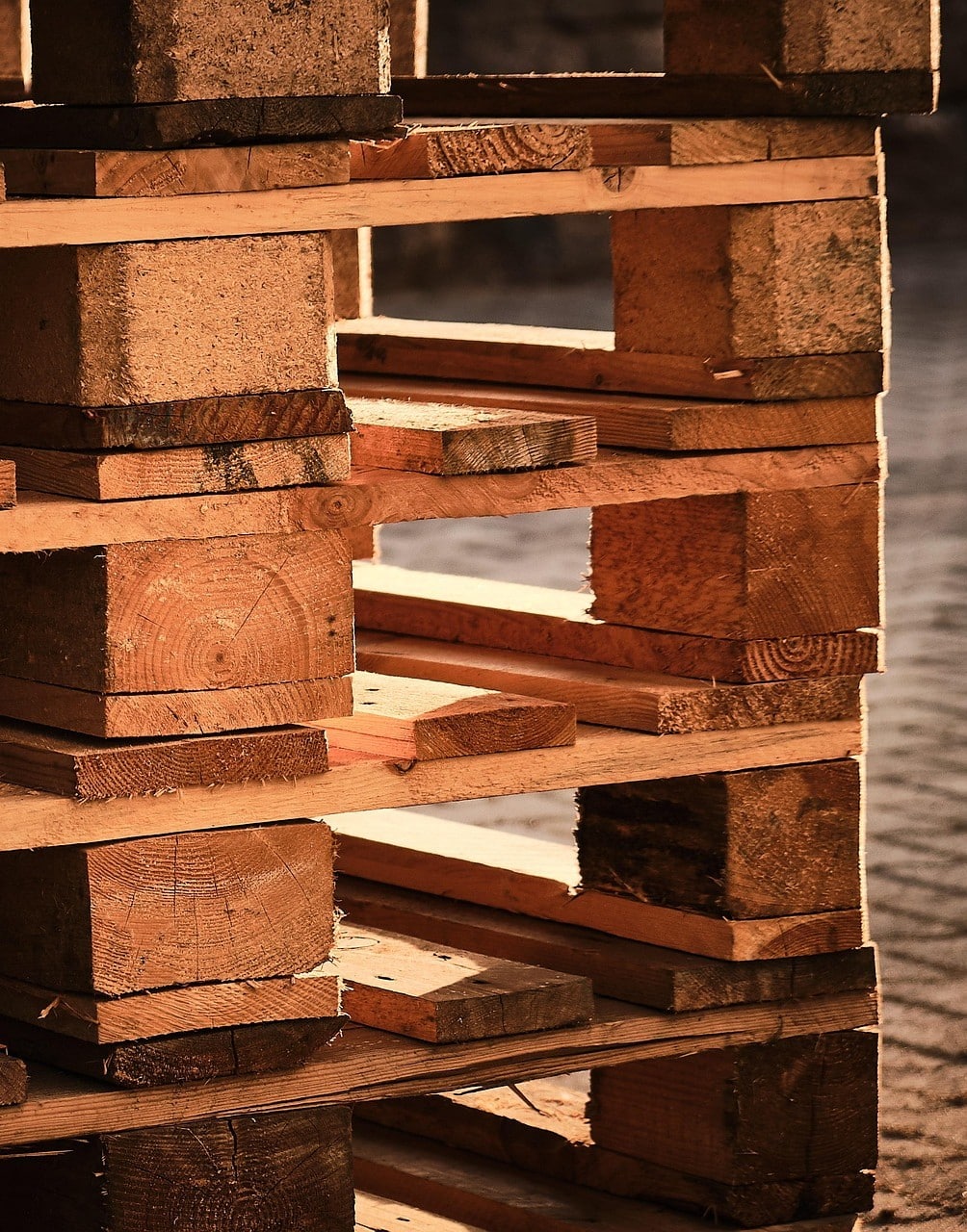 A close-up of a stack of wooden pallets